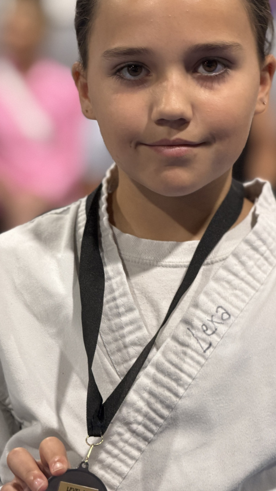 Level 10 Martial Arts student with medal